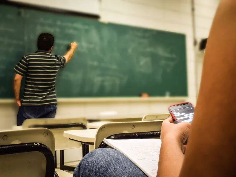 A classroom chalkboard covered in writing
